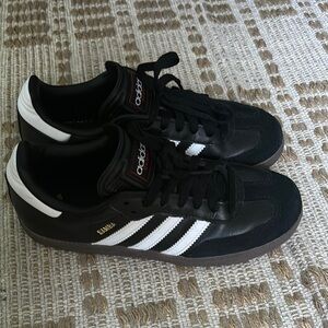 Black and white adidas samba classics
